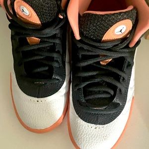 Girl size 3y pink and smoke grey Jordan’s. Lightly worn with original box.